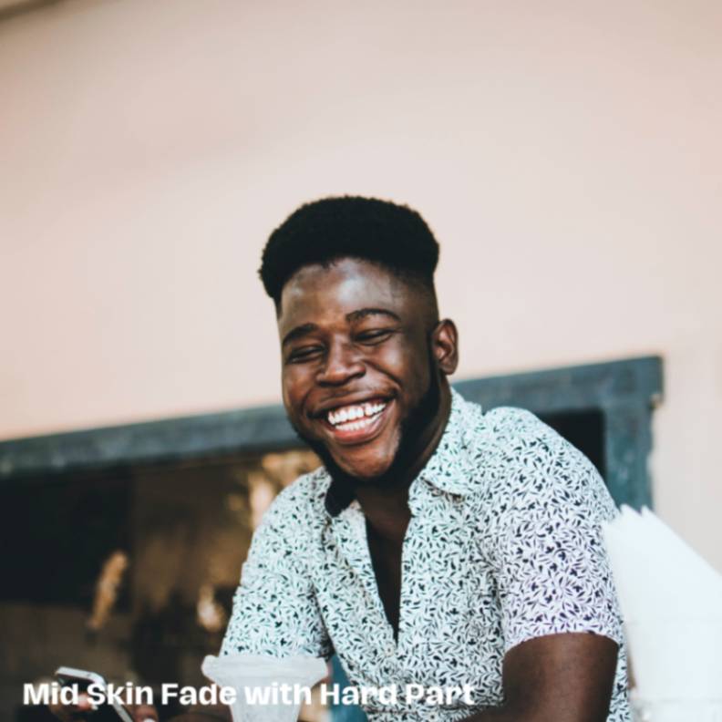 Mid Skin Fade with Hard Part Striking Haircut for Black Men
